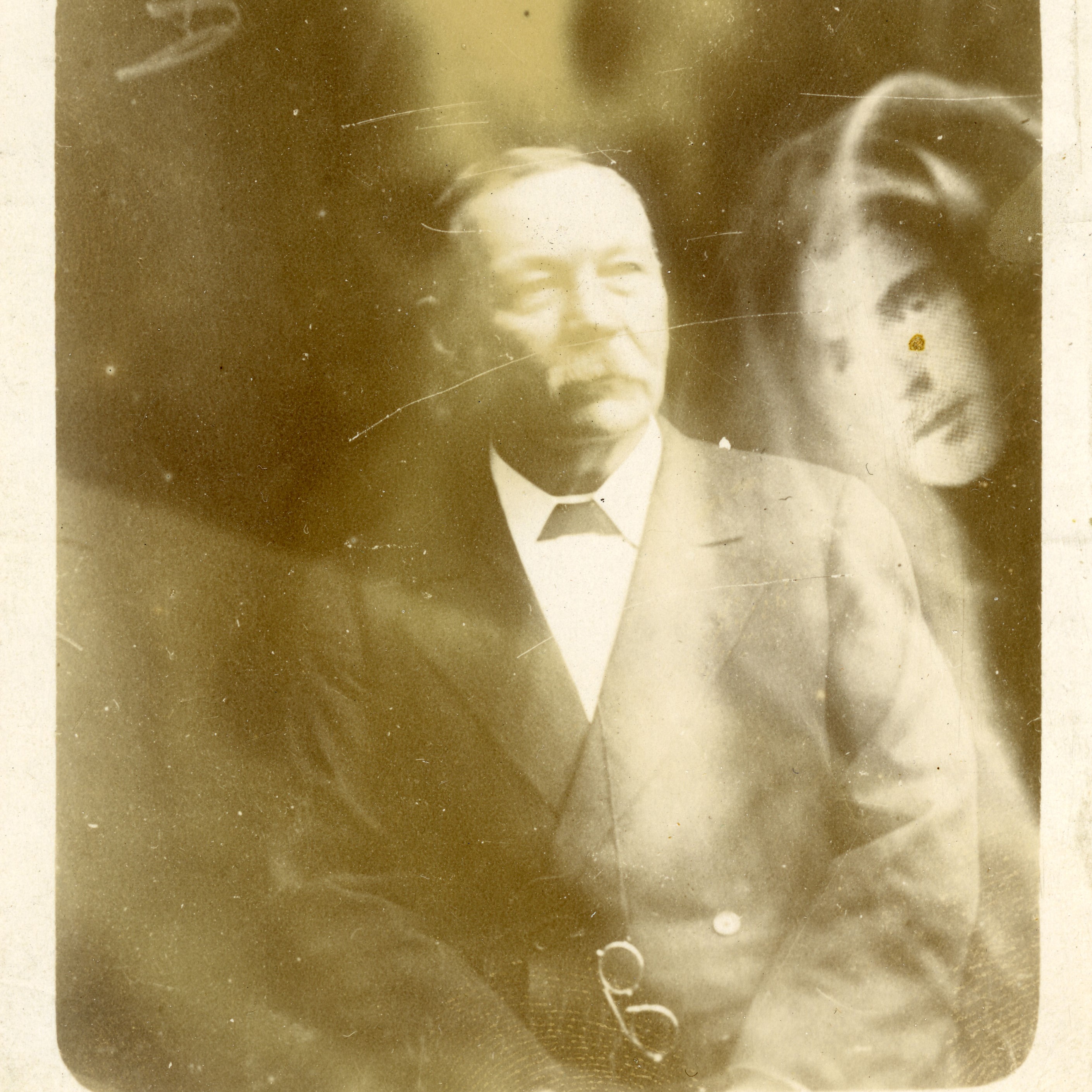 Conan Doyle’s Ghost Hunt, an image of conan doyle with a ghostly face behind him